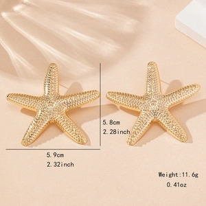 Fashion gold starfish earrings in summer beach style with detailed dot texture surface