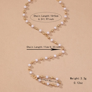 Elegant pearl and gold bead finger bracelet with adjustable chain dimensions and 3.3g weight