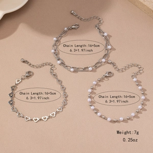 Three-piece silver hollow heart and pearl bracelet set for women with elegant layered design