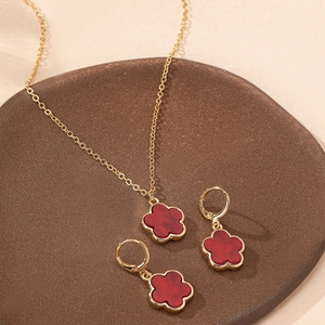 Elegant gold plated necklace and earrings jewelry set with red marble flower pendants