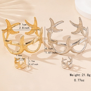 Starfish jewelry set with gold and silver arm cuffs and matching textured rings