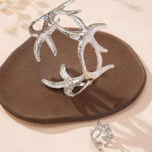Starfish jewelry set featuring silver open cuff bracelet and matching textured ring