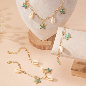 Golden starfish and shell jewelry set featuring blue pendants and an adjustable chain