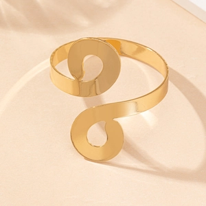 Detailed view of adjustable gold infinity bracelet with a polished mirror finish surface