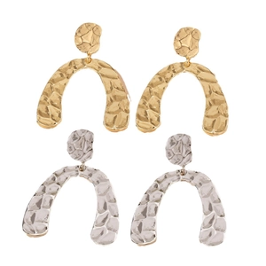 Modern hammered metal U-shape drop earrings in gold and silver finish set on white