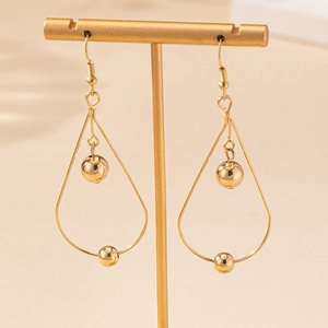 Elegant gold-tone hollow teardrop earrings featuring a dual bead drop design on a hook