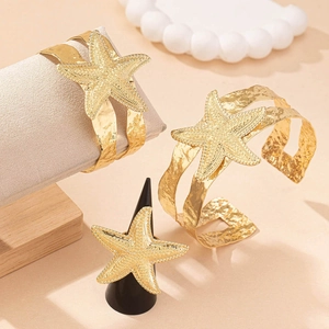 Golden starfish cuff bracelet and ring set with textured finish for ocean style