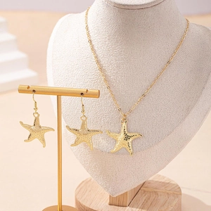 Elegant gold starfish necklace and earrings set with textured finish for women