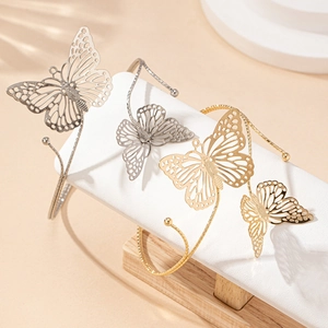 Bracelets de bras papillon dorés et argentés avec un design ajouré sophistiqué