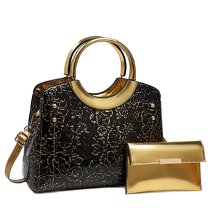 Detail of vintage tote with gold rose embossing and matching gold clutch handbag set