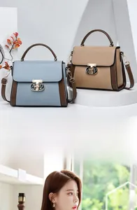 Detail von Handtaschen aus Leder im Color-Block-Design mit Goldschlössern und Trageriemen