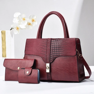 Three-piece burgundy handbag set featuring crocodile pattern embossed faux leather