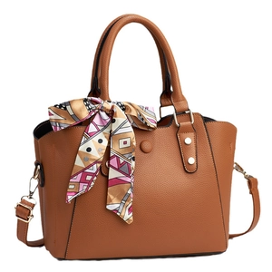 Brown litchi pattern leather tote bag with decorative silk scarf and adjustable strap