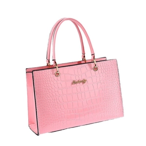 Pink faux crocodile leather tote bag with elegant gold metal handles and hardware