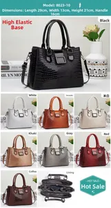 Détail montrant la texture motif lézard et l'intérieur du sac à main pour femmes