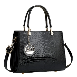Elegant black lizard pattern faux leather tote bag with gold hardware and swan charm
