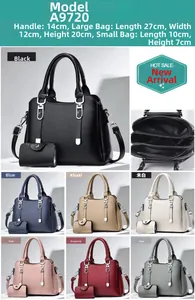 Detailed view of the large capacity tote bag with silver hardware and inner pouch