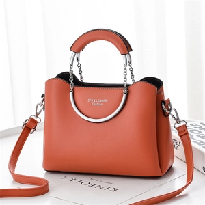 Vibrant orange chain square bag with silver metal handle and adjustable leather strap