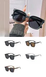 Close-up of stylish oversized square sunglasses showing multiple frame colors and measurements