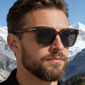 Fashionable square frame sunglasses for men with silver metal accents in an outdoor snow setting