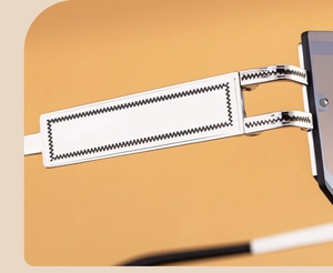 Detailed close-up of silver metal temple with black wave texture on stylish sunglasses