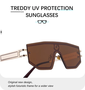 Detail of golden metal eyewear temples with intricate hollow carvings and textured design