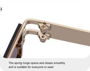 Detail of golden metal spring hinge for smooth opening and closing of fashion sunglasses