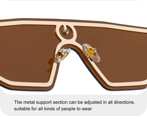 Detail of adjustable clear silicone nose pads and gold metal bridge on oversized sunglasses