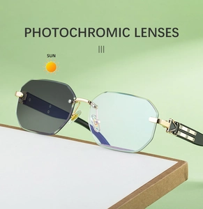 Detailed view of frameless photochromic lenses showing color change from blue to grey