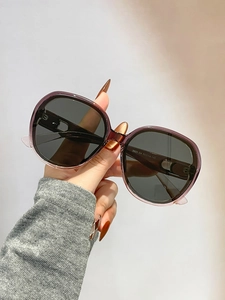 Detail view of square gradient purple frame sunglasses with model specs on temple