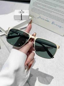 Close-up of square nylon polarized sunglasses with double-bridge champagne gold frame
