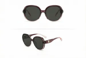 Detail of square oversized nylon sunglasses with gradient purple frames and gold metal accents