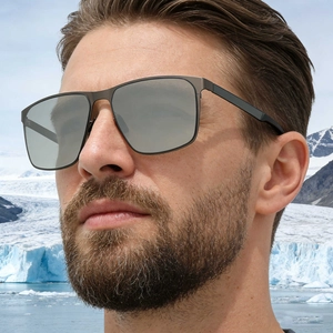 Mens square polarized sunglasses with matte gunmetal frame shown on model in snowy landscape