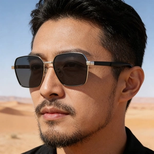 Men's square metal sunglasses with dark grey lenses shown in a desert outdoor setting