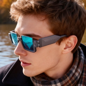 Side view of square sunglasses with blue mirrored lenses on male model outdoors