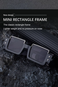 Detail view of mini rectangular sunglasses with silver metal rivets on dark stone