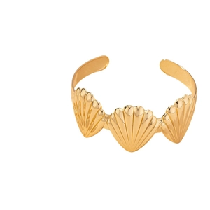 Golden open cuff bracelet with three seashell motifs featuring a radiant metallic texture