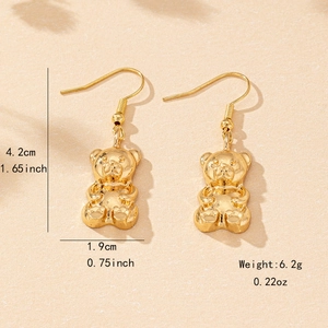 Cute golden bear earrings with French hooks showing product dimensions and weight