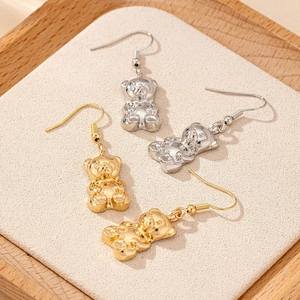 Creative 3D bear earrings in gold and silver finish with fish hook design on tray