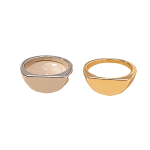 Minimalist geometric semi-circle signet ring set in polished gold and silver metal finishes