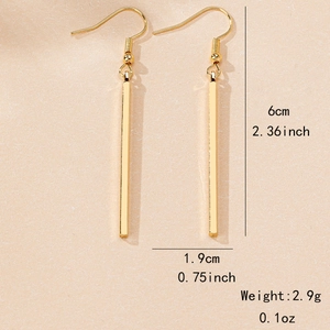 Minimalist gold geometric rectangular drop earrings with size measurements in 6cm length