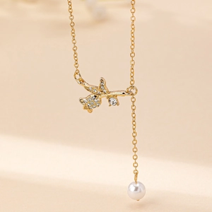 Elegant rose necklace with sparkling cubic zirconia and white pearl pendant in gold finish