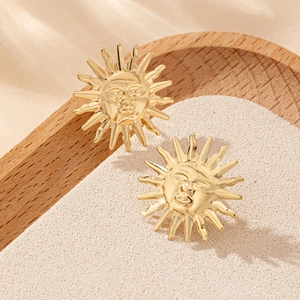 French vintage sun face gold stud earrings with elegant ray-shaped metal relief design