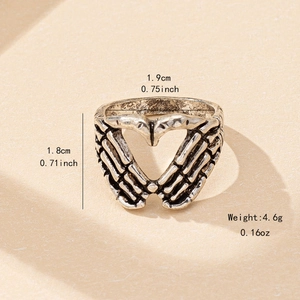 Bague gothique punk en forme de mains de squelette formant un cœur en argent antique