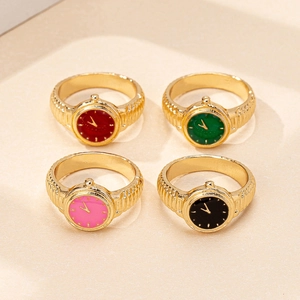 Set of four vintage gold watch rings with colorful enamel dials in a 2x2 grid display