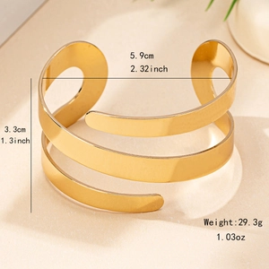 Minimalist wide gold open cuff bracelet with geometric spiral design and high polish