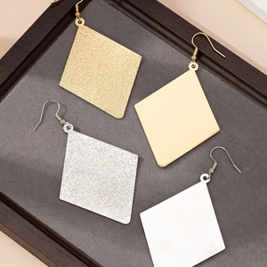 Minimalist geometric diamond drop earrings in gold and silver with matte and frosted finishes