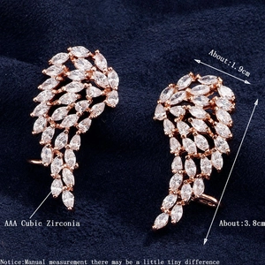 Detailed size chart for rose gold wing earrings featuring AAA cubic zirconia stones