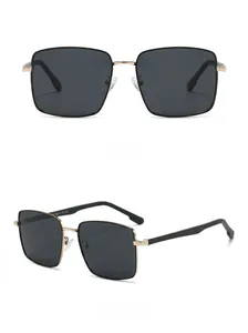 Detail view of square polarized sunglasses with golden metal hinges and black frame
