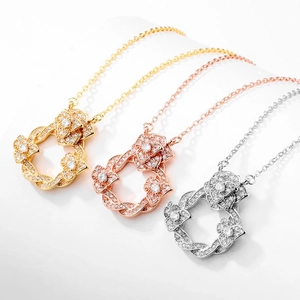 Collier pendentif fleur de camélia entrelacé en or argent et or rose avec zircons